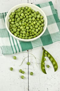 Green Peas On White Ceramic Bowl